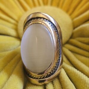 Gold ring with white stone